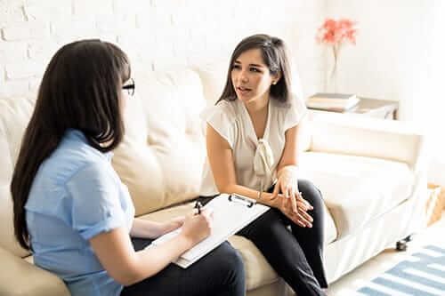 Womens Addiction Rehab In NC two women discussing the need for a womens addiction rehab in NC